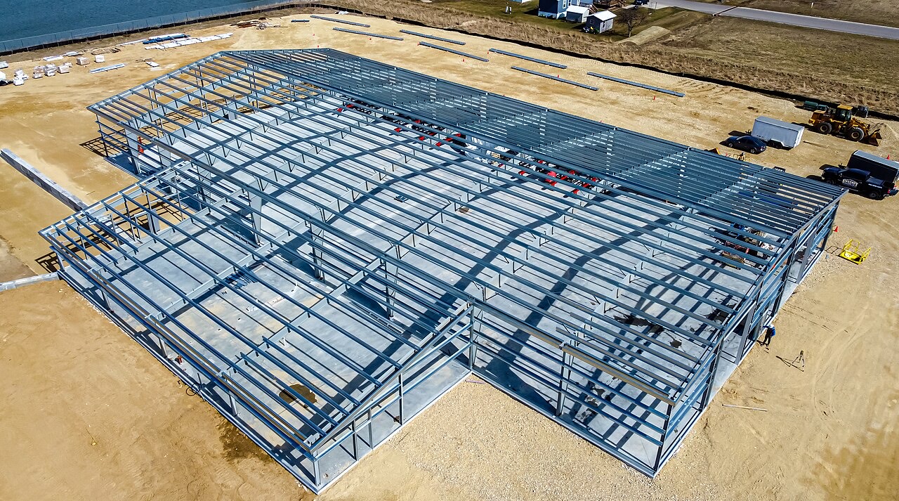A steel-framed building under construction viewed from above.