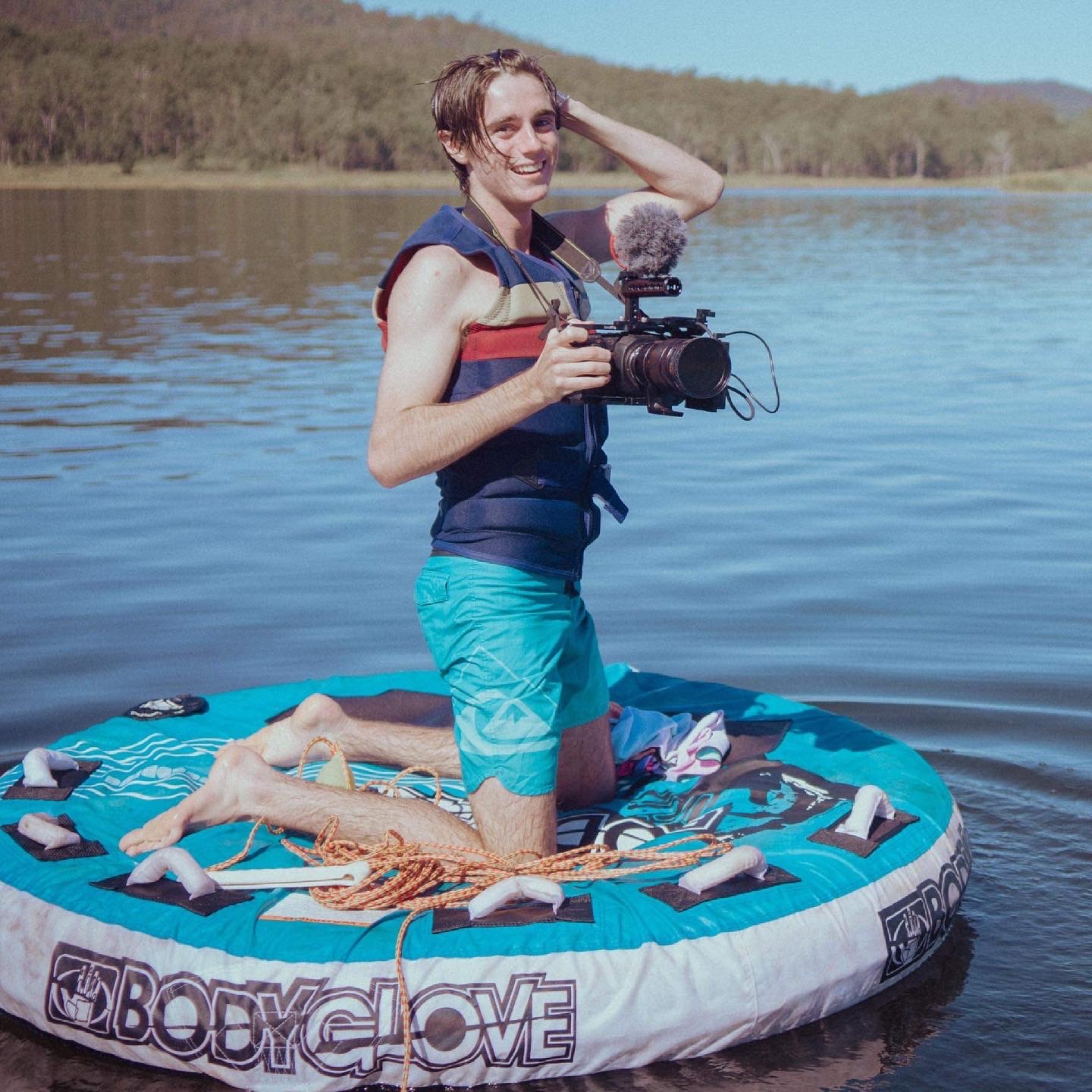 Mikayo filming from the water with a cinema camera